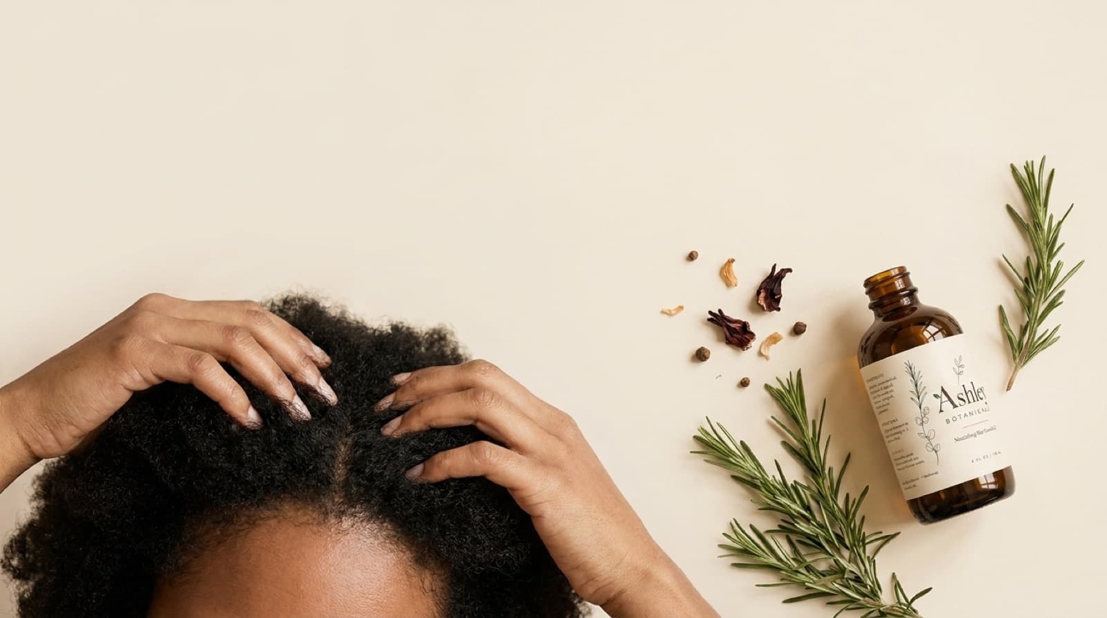 How to use rosemary oil for hair growth — woman massaging Ashley Botanicals rosemary hair oil into her scalp